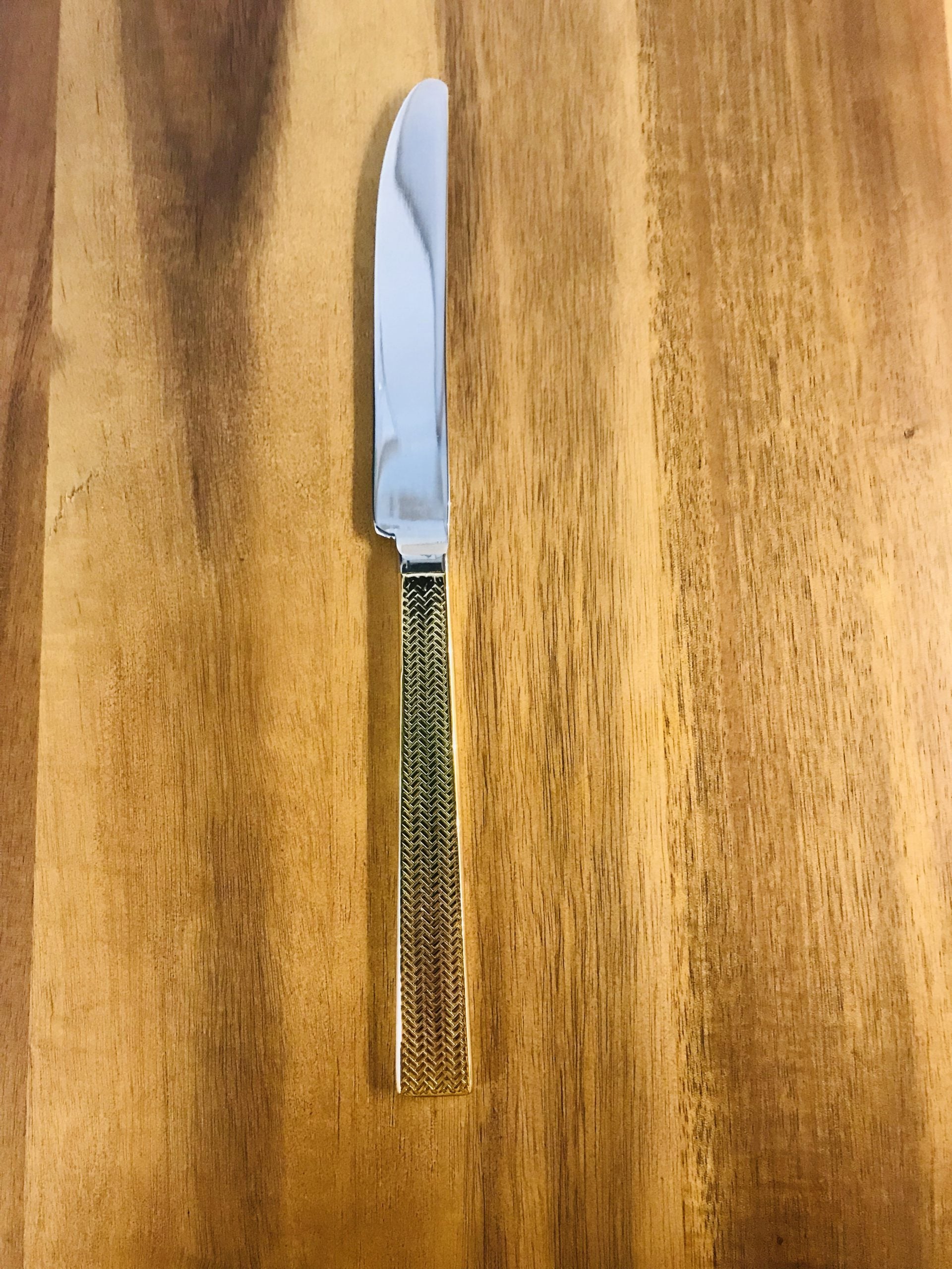 Gold handle dinner knife